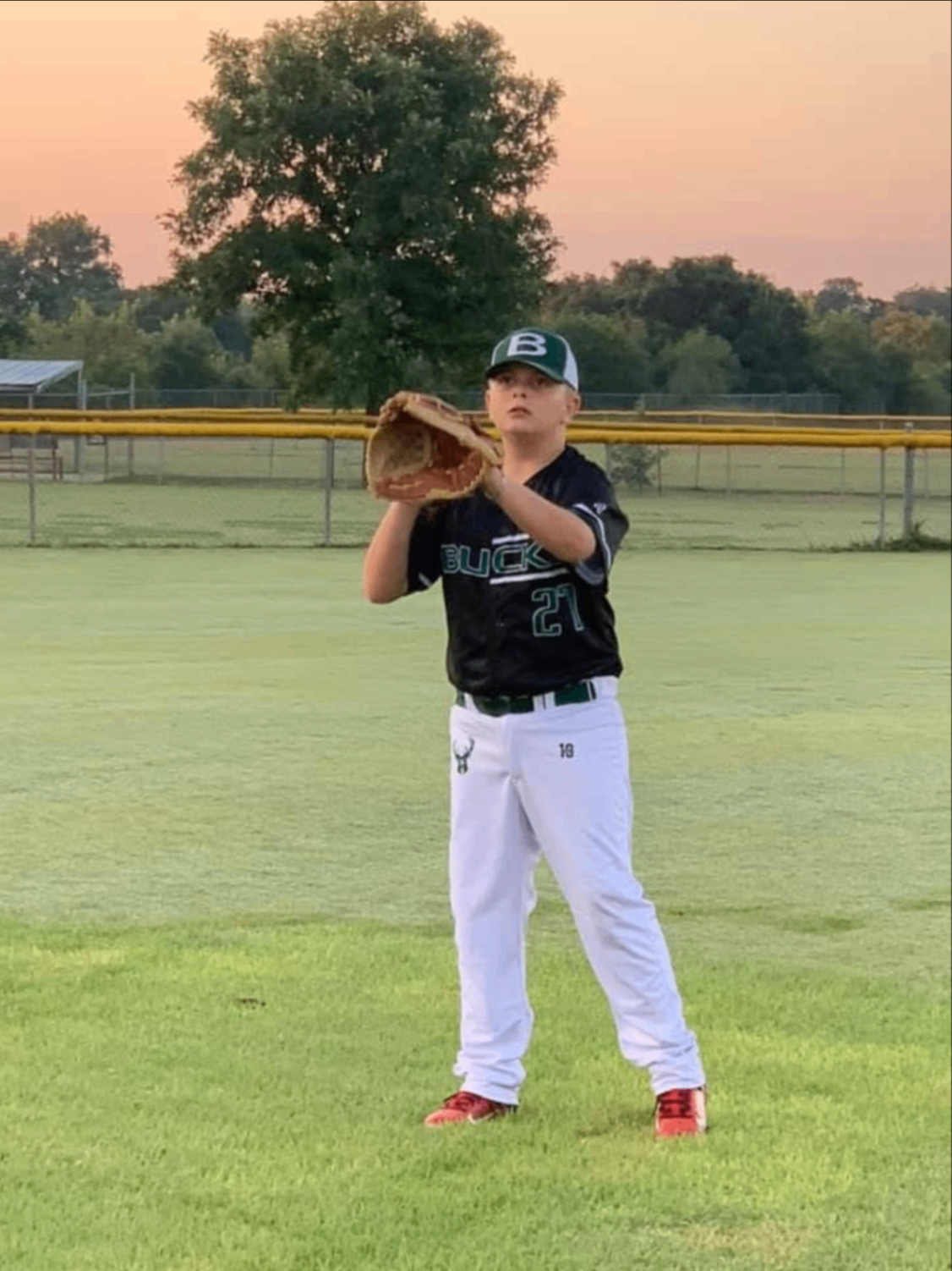 Boerne Bucks player catching in the outfield